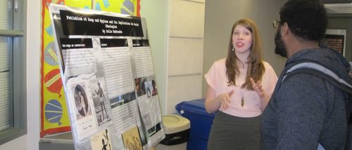 Poster presenter and Human Development and Social Relations student, Julie Kedroske, explaining her poster to students at the 2011 Hightower Syposium.